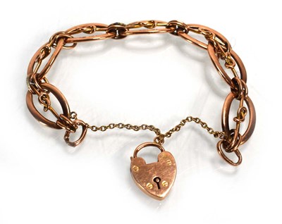 Lot 730 - A 9ct rose gold oval link bracelet with heart...