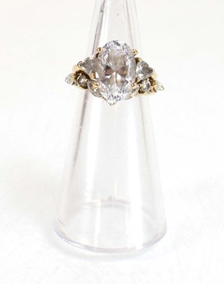Lot 724 - A 9ct yellow gold ring set oval and trilliant...