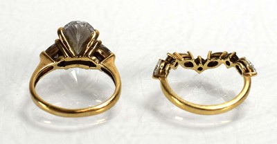 Lot 724 - A 9ct yellow gold ring set oval and trilliant...