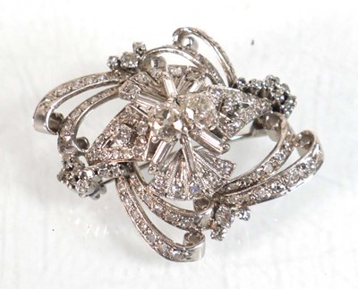 Lot 751 - A white metal openwork brooch centrally set...