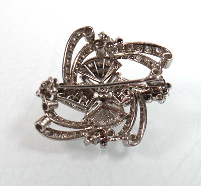 Lot 751 - A white metal openwork brooch centrally set...