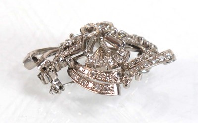 Lot 751 - A white metal openwork brooch centrally set...