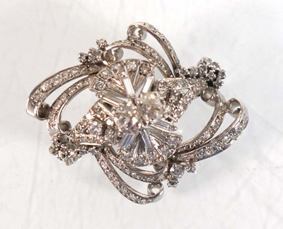 Lot 751 - A white metal openwork brooch centrally set...