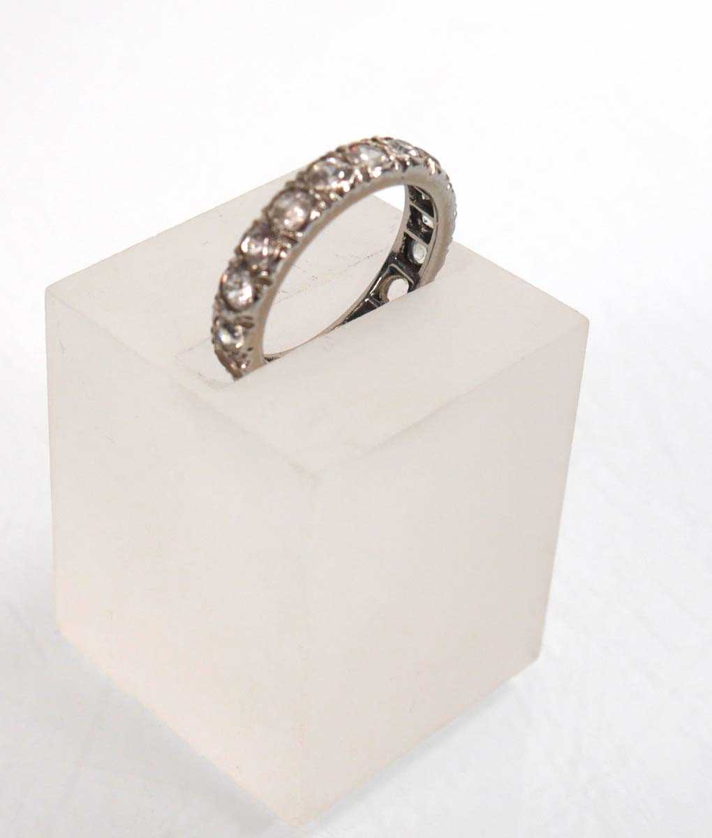 Lot 755 - A white metal full eternity ring set white...
