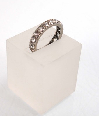 Lot 755 - A white metal full eternity ring set white...