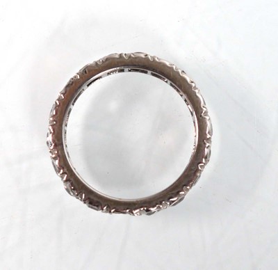 Lot 755 - A white metal full eternity ring set white...