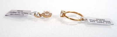 Lot 759 - A 9ct yellow gold ring set oval clear stone in...