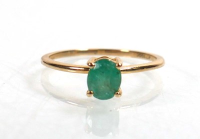 Lot 763 - A 9ct yellow gold ring set oval emerald within...