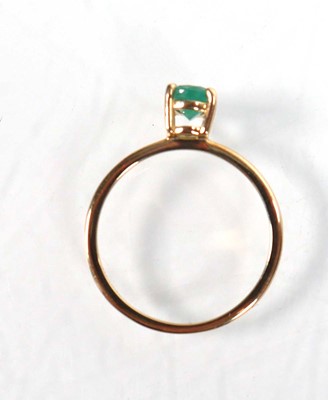 Lot 763 - A 9ct yellow gold ring set oval emerald within...