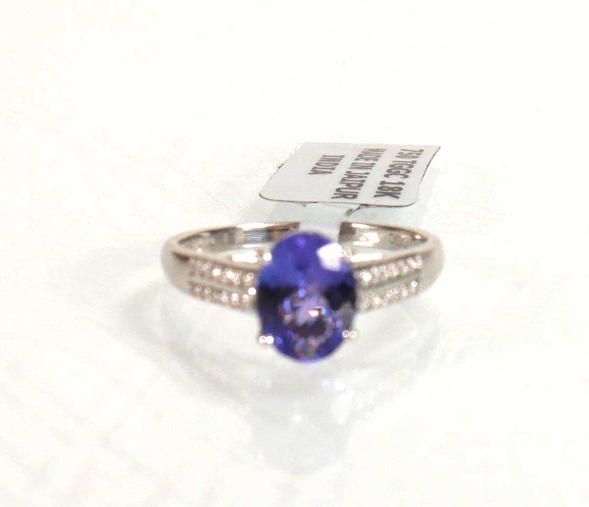 Lot 764 - An 18ct white gold ring set oval tanzanite...