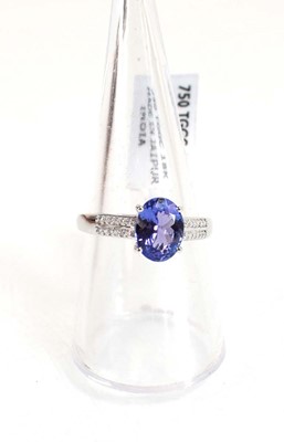 Lot 764 - An 18ct white gold ring set oval tanzanite...