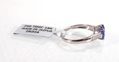 Lot 764 - An 18ct white gold ring set oval tanzanite...