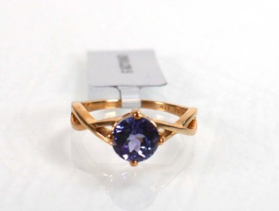 Lot 765 - A 14ct yellow gold ring set round tanzanite...