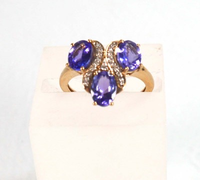 Lot 767 - A 9ct yellow gold ring set three oval...