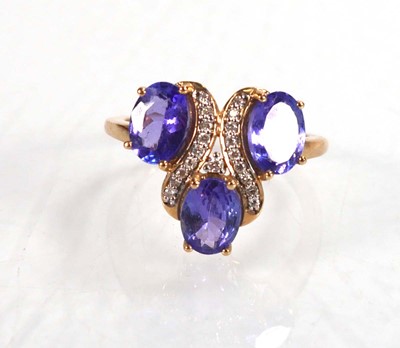 Lot 767 - A 9ct yellow gold ring set three oval...