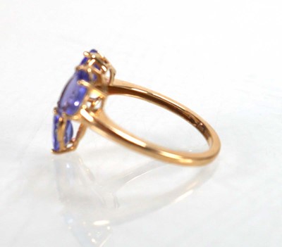 Lot 767 - A 9ct yellow gold ring set three oval...