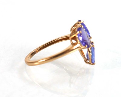 Lot 767 - A 9ct yellow gold ring set three oval...