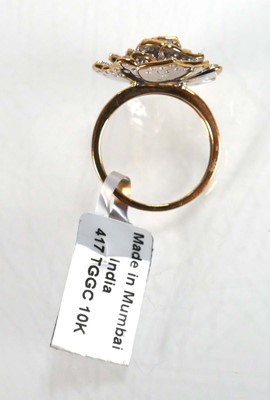 Lot 768 - A 9ct yellow gold flowerhead ring set layers...