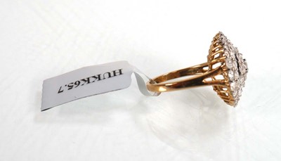Lot 769 - A 9ct yellow gold ring set small diamonds in...
