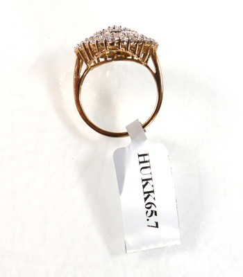 Lot 769 - A 9ct yellow gold ring set small diamonds in...