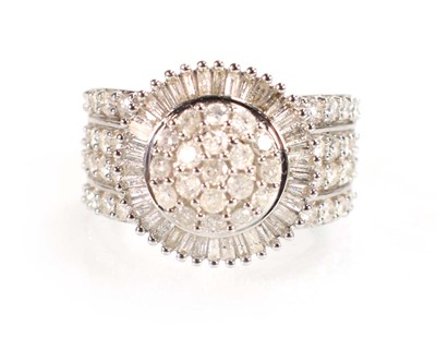 Lot 771 - A 9ct white gold ring set small diamonds in a...
