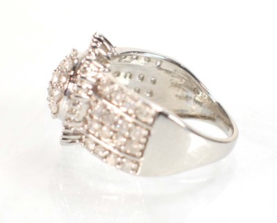 Lot 771 - A 9ct white gold ring set small diamonds in a...
