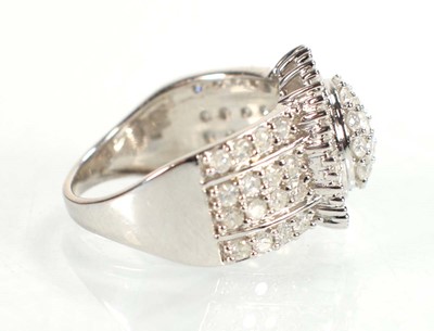 Lot 771 - A 9ct white gold ring set small diamonds in a...