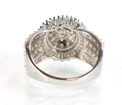 Lot 771 - A 9ct white gold ring set small diamonds in a...