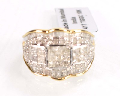 Lot 772 - A 9ct white gold ring set small brilliant,...