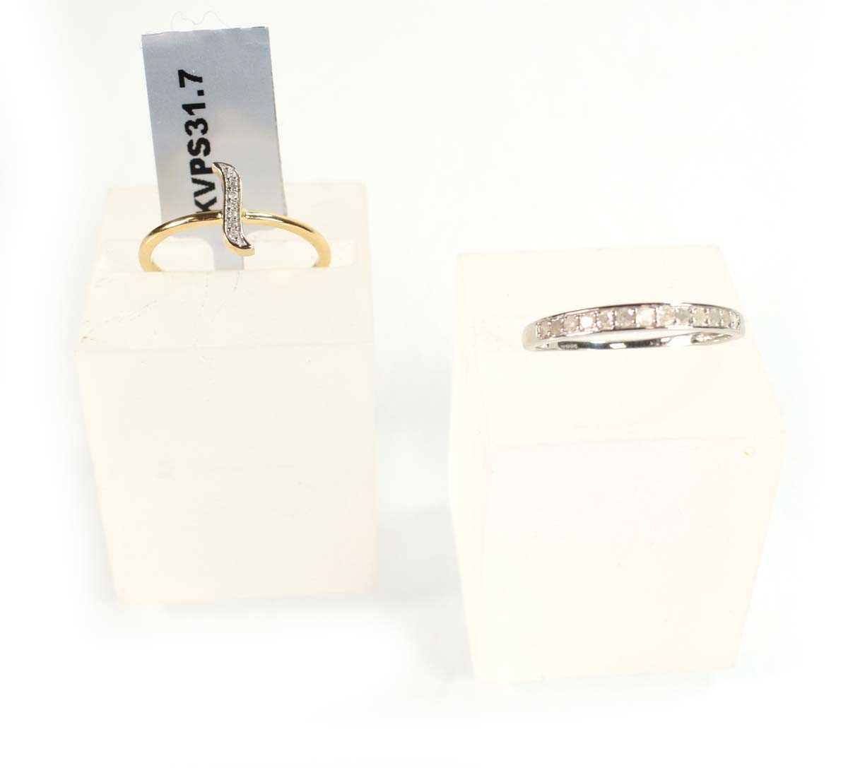 Lot 773 - A 9ct white gold half eternity ring set small...