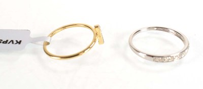 Lot 773 - A 9ct white gold half eternity ring set small...