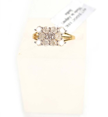 Lot 774 - A 9ct yellow gold ring set three rows of small...
