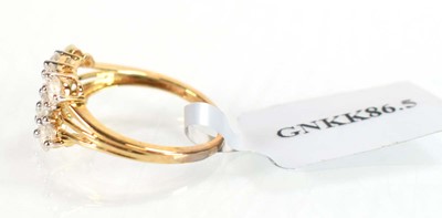 Lot 774 - A 9ct yellow gold ring set three rows of small...