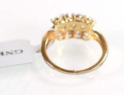 Lot 774 - A 9ct yellow gold ring set three rows of small...