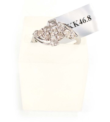 Lot 775 - A 9ct white gold crossover ring set small...