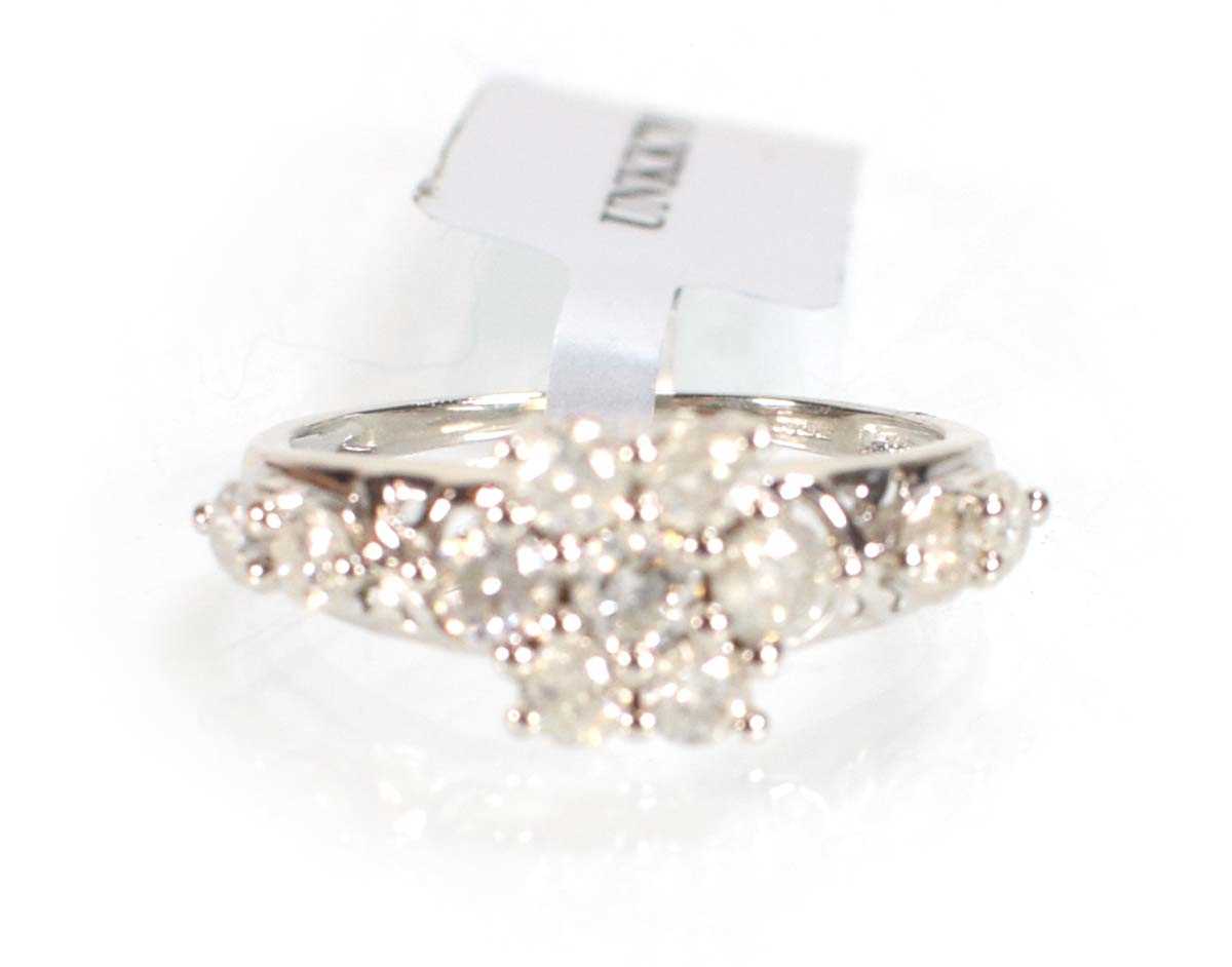 Lot 776 - A 9ct white gold flowerhead ring set small...