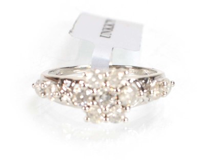Lot 776 - A 9ct white gold flowerhead ring set small...