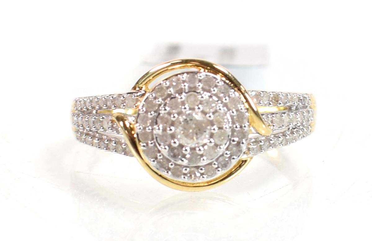 Lot 777 - A 9ct yellow gold ring set small diamonds in a...