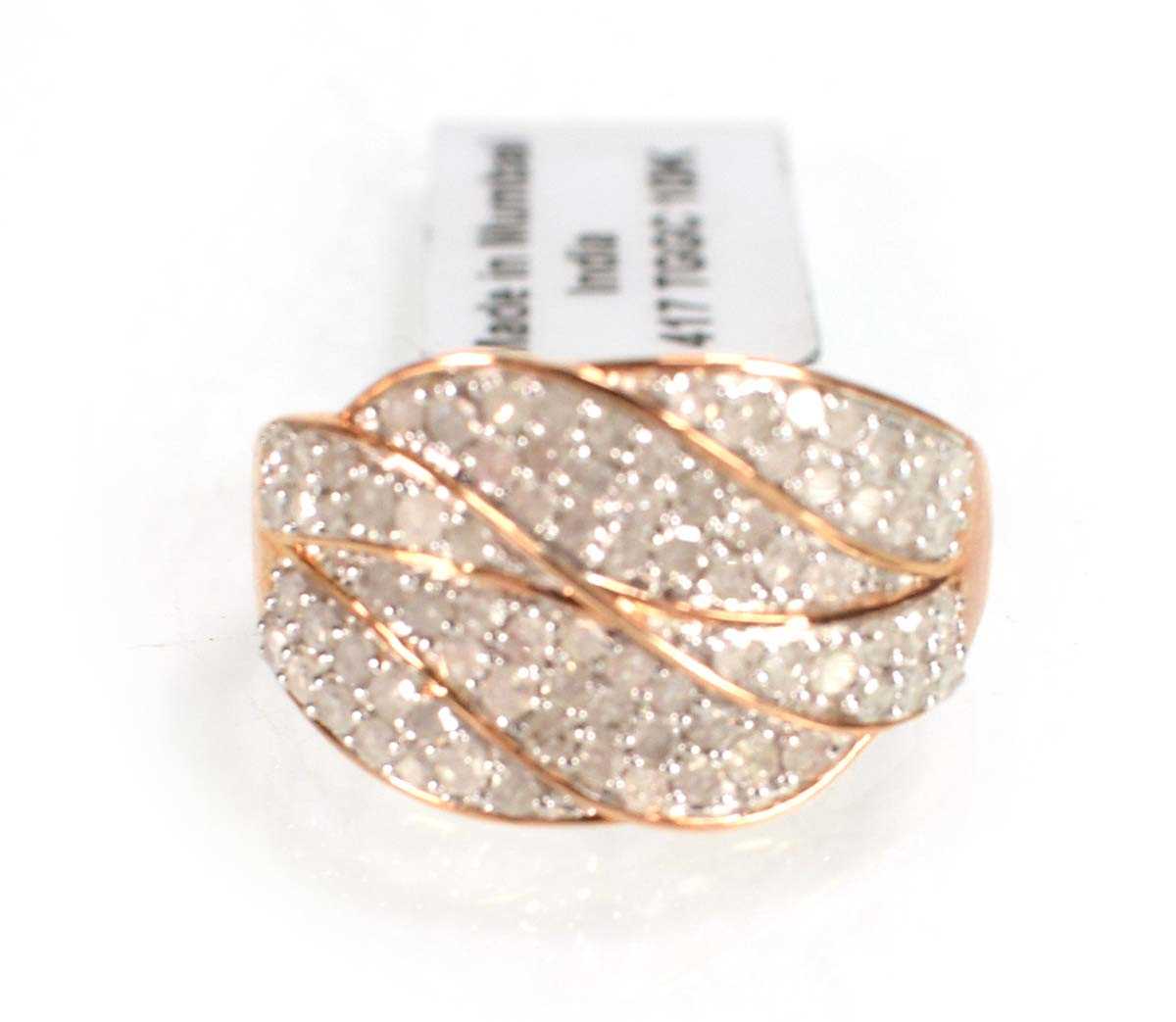 Lot 779 - A 9ct rose gold ring set small diamonds in a...
