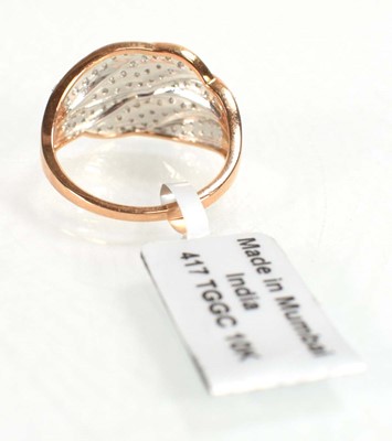 Lot 779 - A 9ct rose gold ring set small diamonds in a...