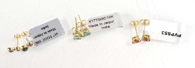 Lot 780 - Three pairs of 9ct yellow gold ear studs sets...