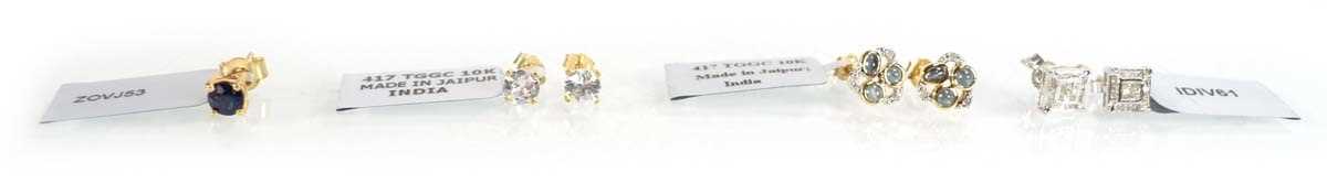 Lot 781 - A pair of 9ct yellow gold ear studs set small...