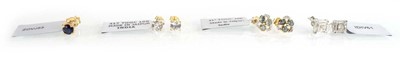 Lot 781 - A pair of 9ct yellow gold ear studs set small...