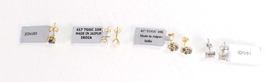 Lot 781 - A pair of 9ct yellow gold ear studs set small...