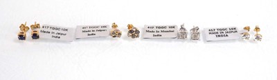 Lot 781 - A pair of 9ct yellow gold ear studs set small...