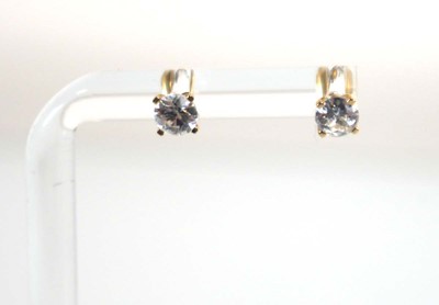 Lot 781 - A pair of 9ct yellow gold ear studs set small...