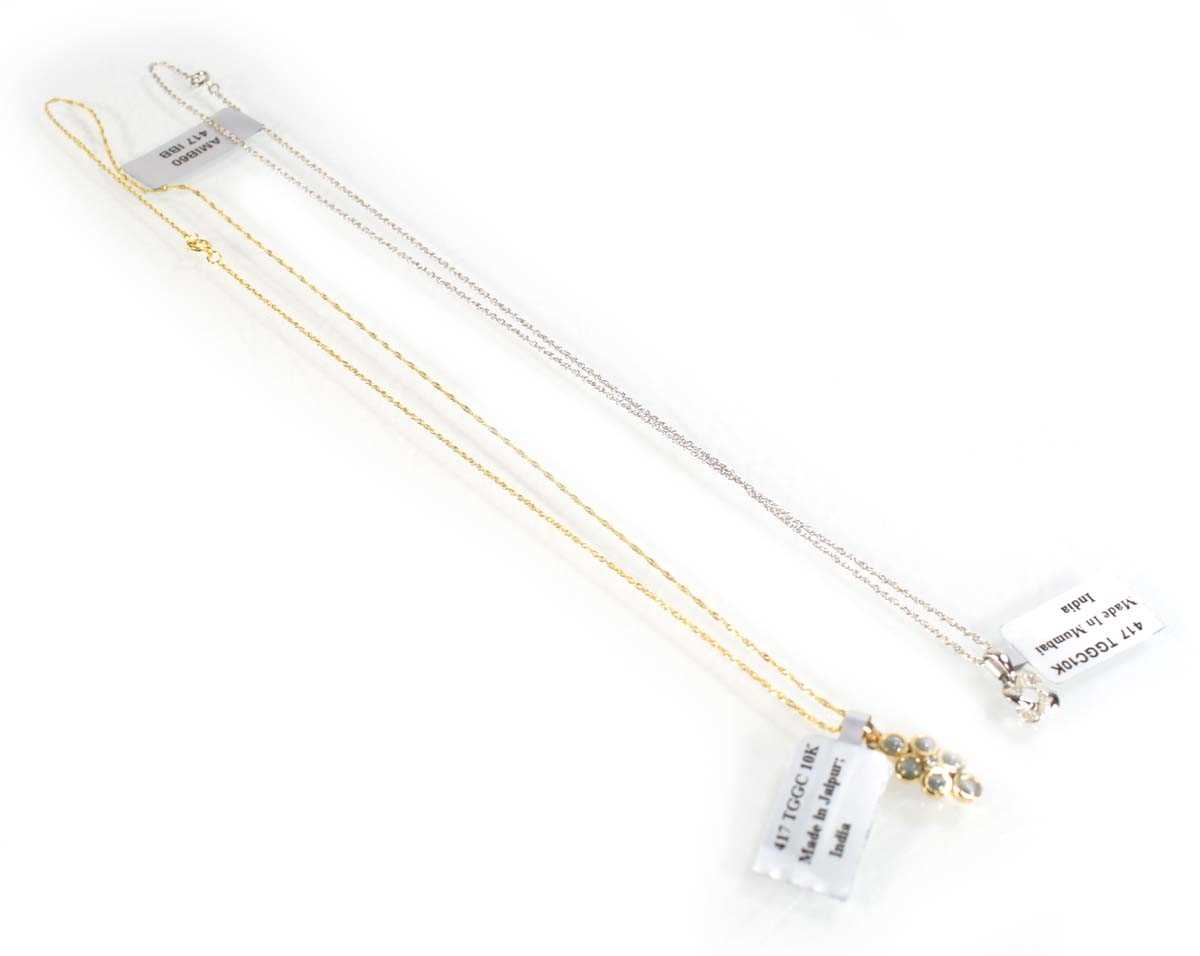 Lot 783 - A 9ct white gold pendant necklace set small...