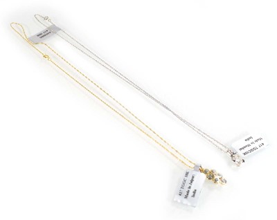 Lot 783 - A 9ct white gold pendant necklace set small...