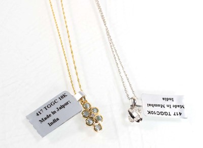 Lot 783 - A 9ct white gold pendant necklace set small...