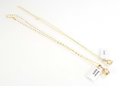 Lot 784 - Two 9ct yellow gold pendant necklaces, each...
